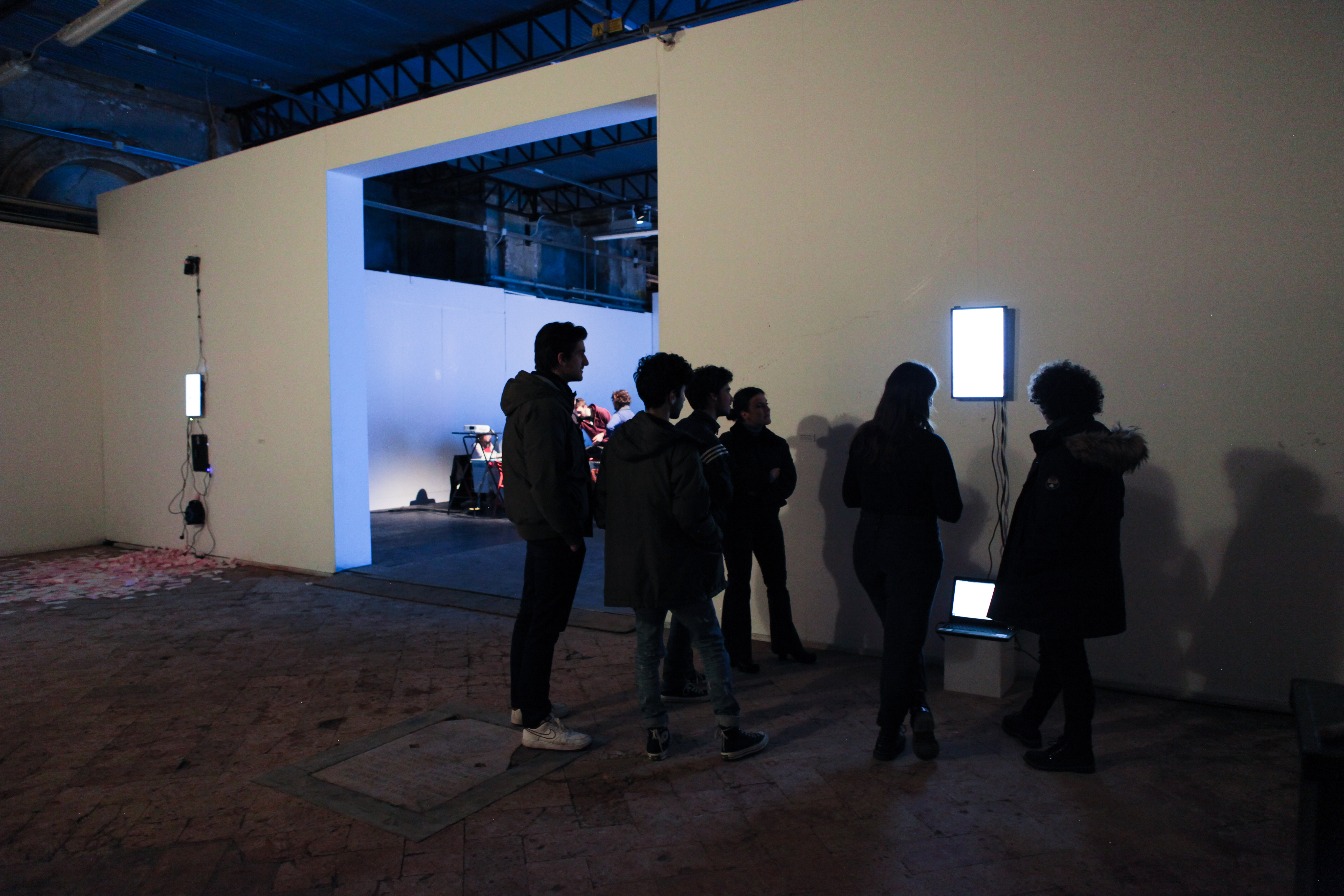 A group of students around a data visualizaton work during the opening